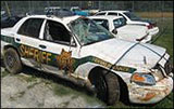 Workers Comp - wrecked patrol car